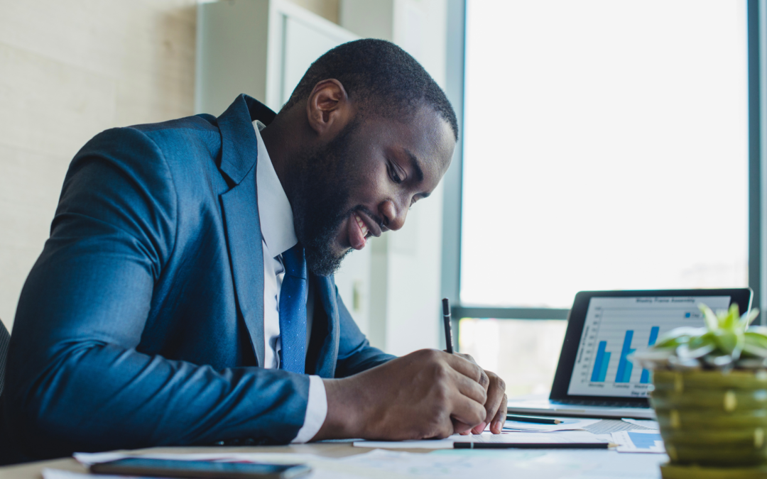 A person reviewing financial plans and investment strategies, symbolizing wealth-building and financial independence.